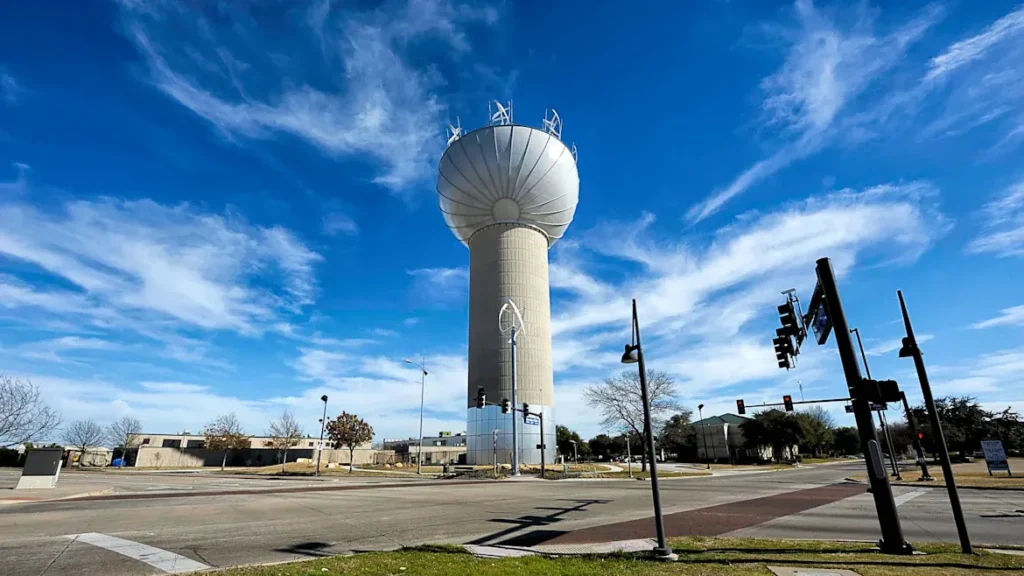 Addison water tower landmark under a blue sky
