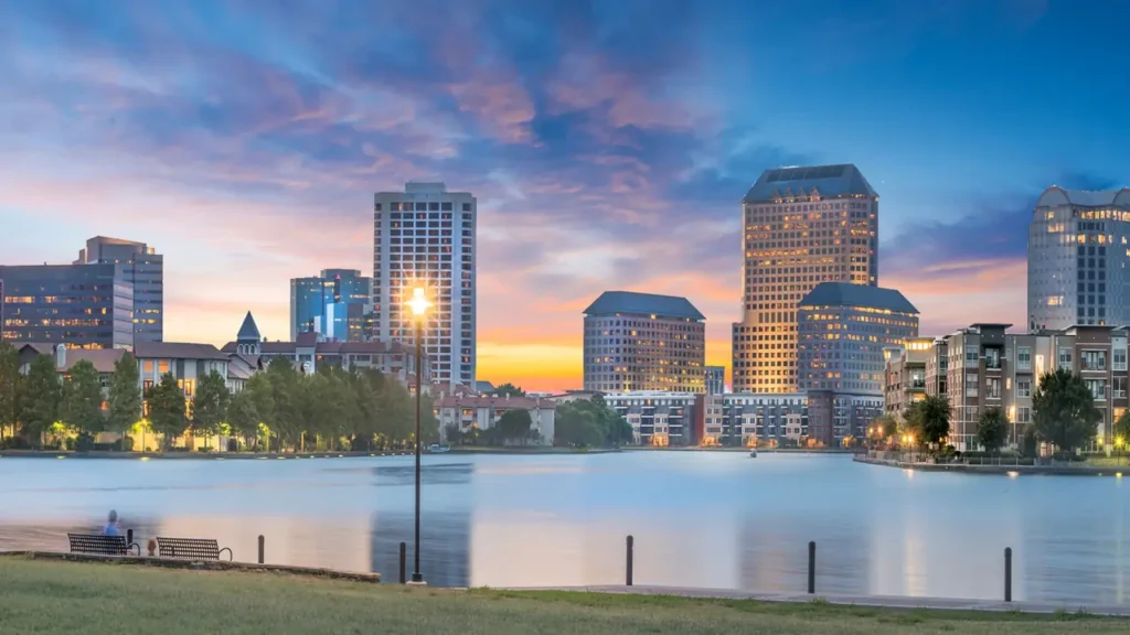 Las Colinas skyline over Lake Carolyn at sunset